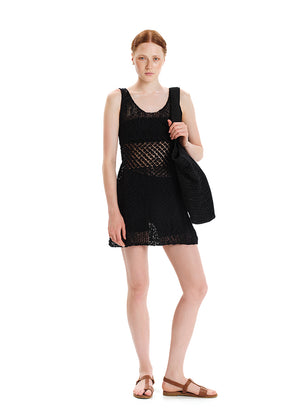 Sleeveless top- dress made of cotton yarn with a unique texture.It has a comfortable fit and it is sleeveless with a straight neckline. Knit pattern is changing where the body needs to be covered. 