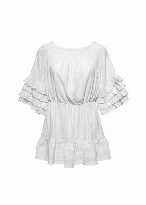White ruffled blouse on a white background