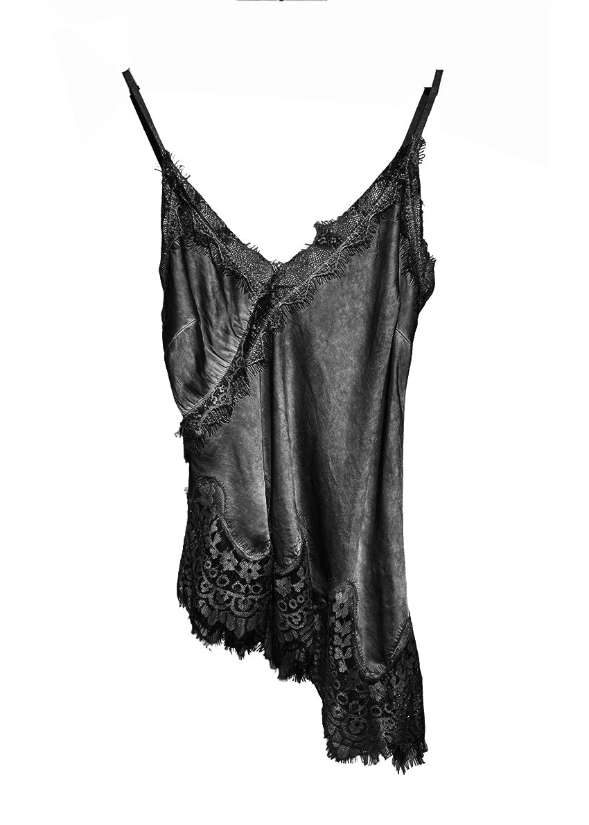 Black lace-trimmed slip on a white background