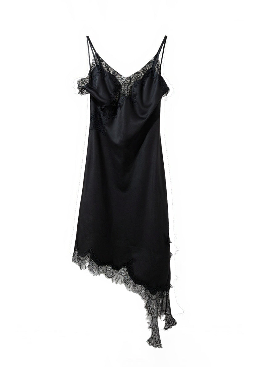 Black satin slip dress with lace details on a white background