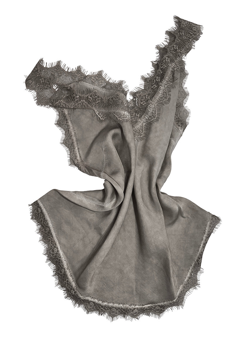 Gray top with lace trim on a white background