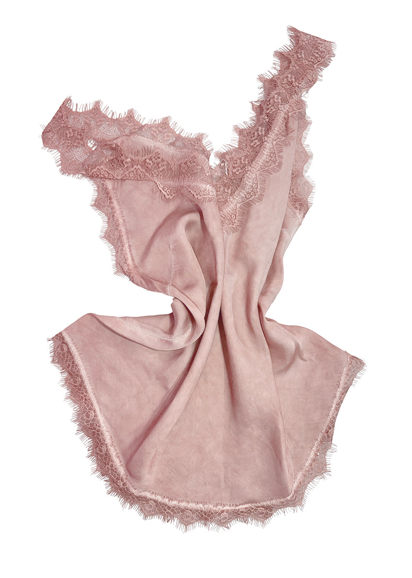 Pink lace top on a white background