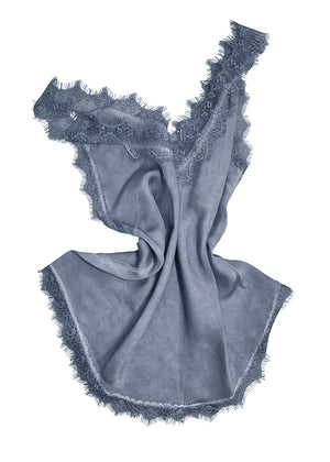 Blue top with lace trim on a white background