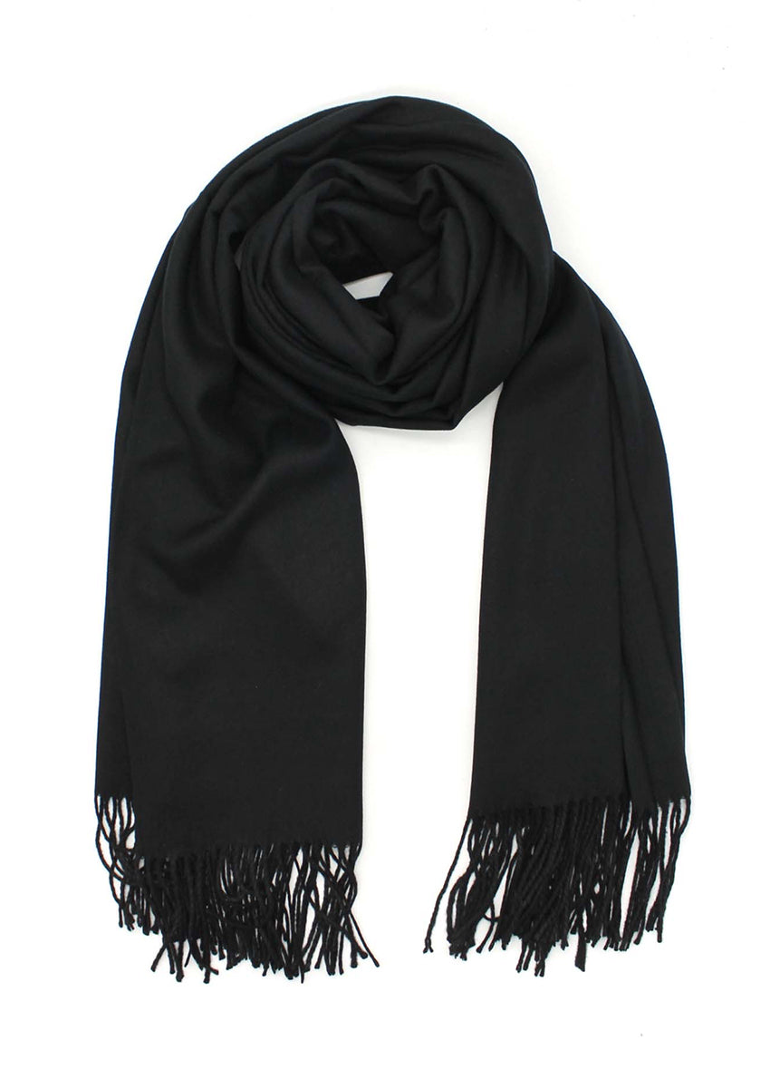 Black shawl with fringed details on a white background