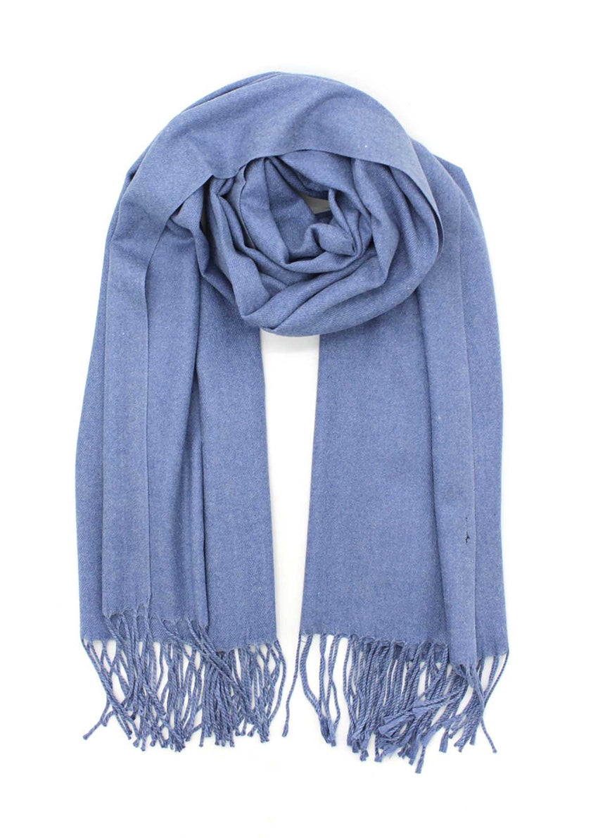 Blue shawl with fringed details on a white background 