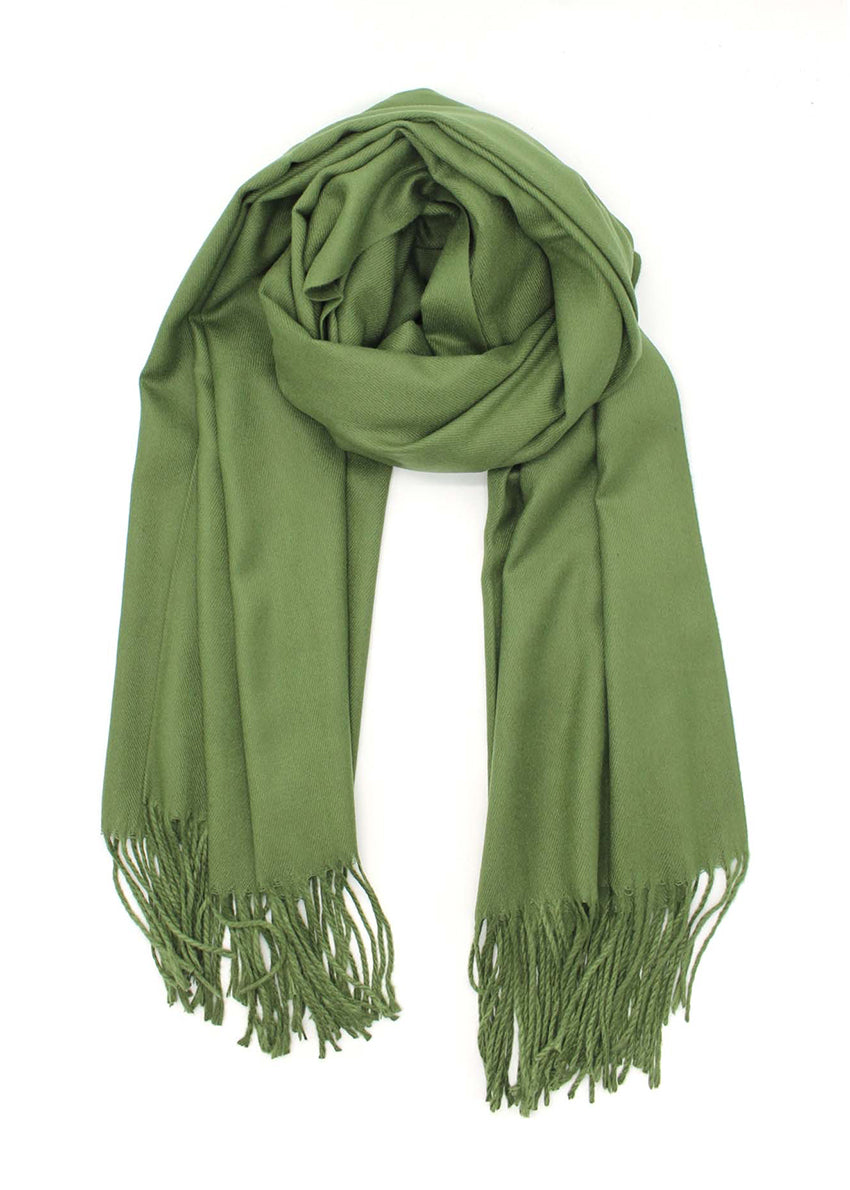 Green shawl with fringed details on a white background