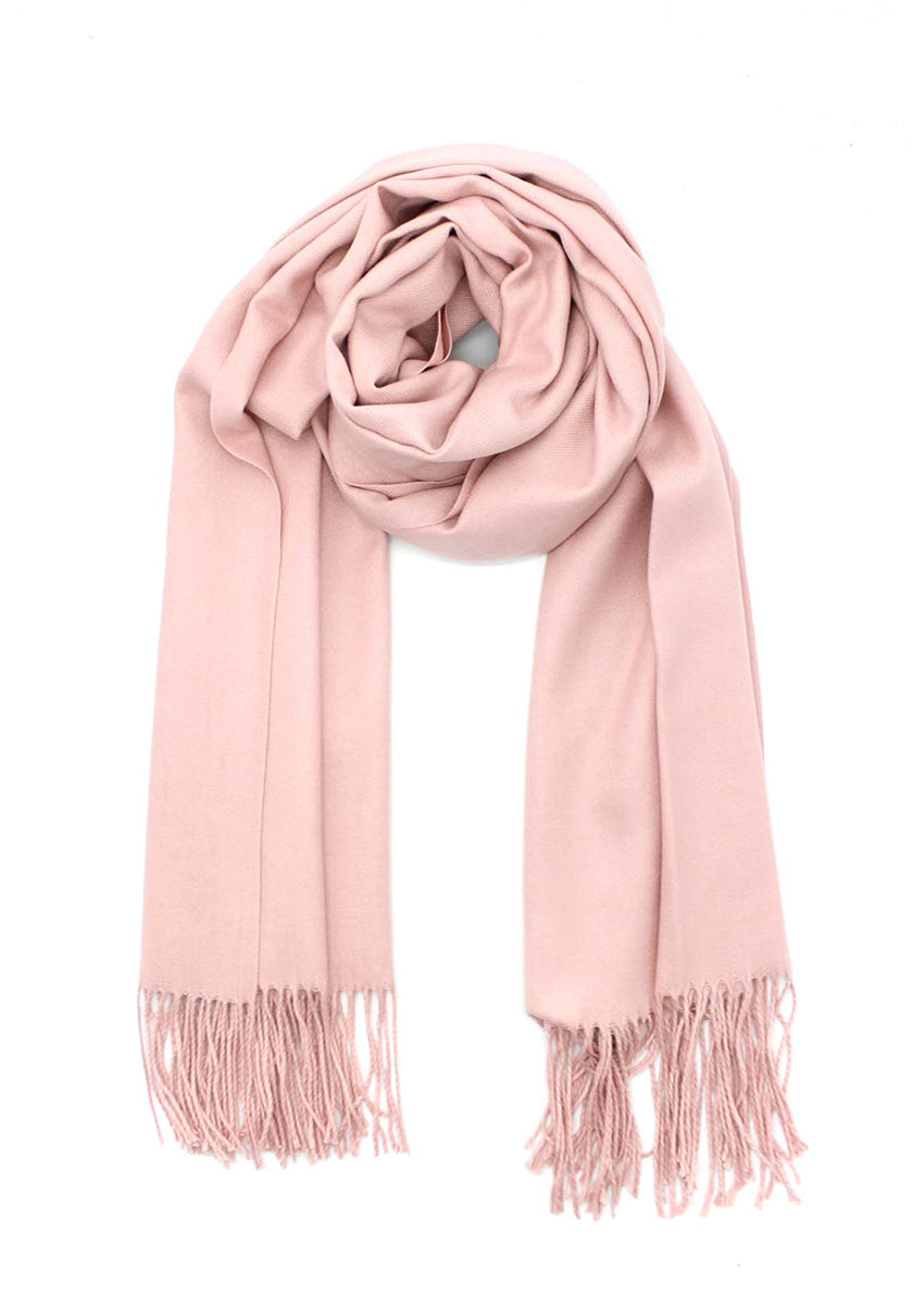 Light pink shawl with fringed details on a white background