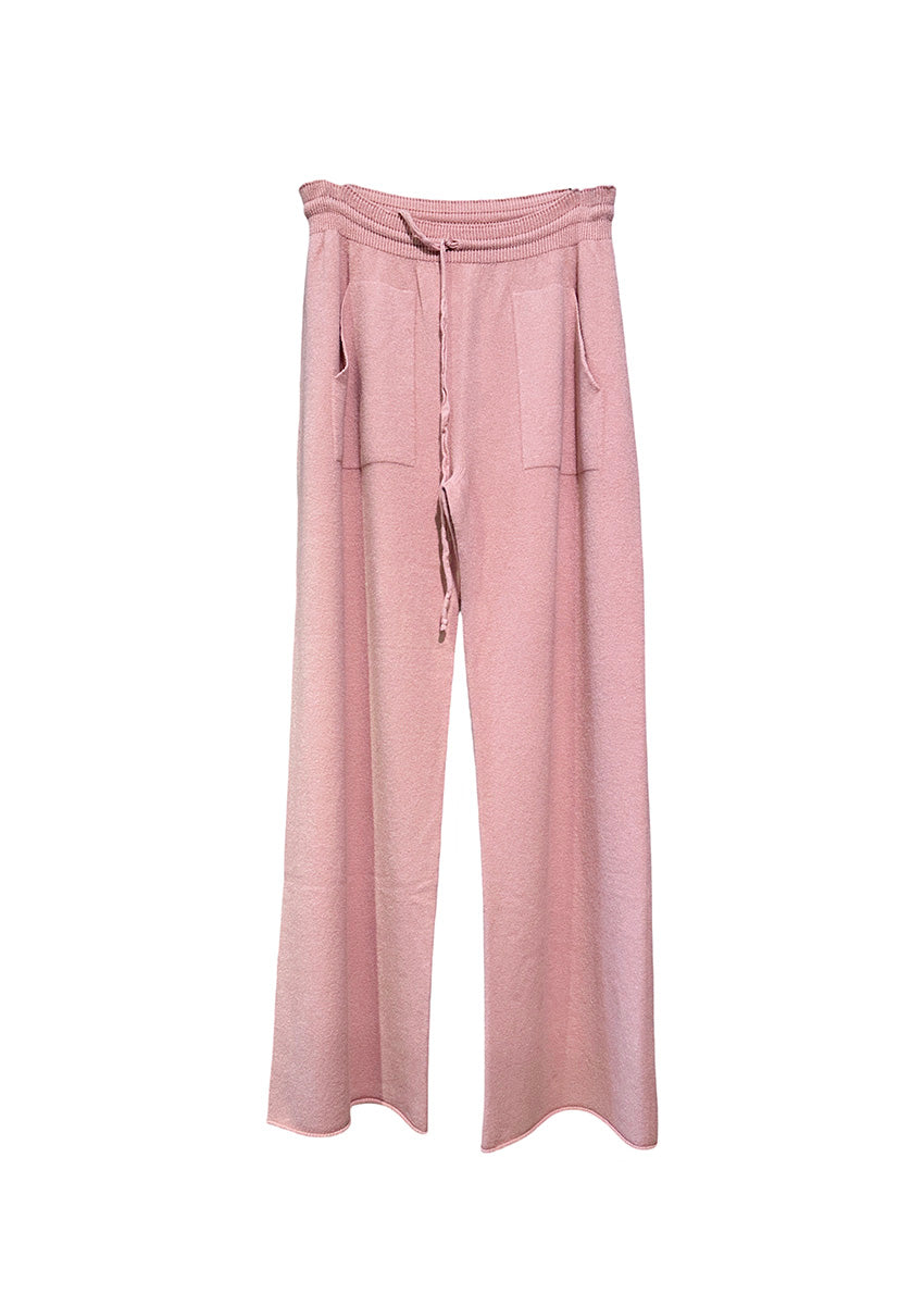 Pink knit long wide pants with pockets on a white background