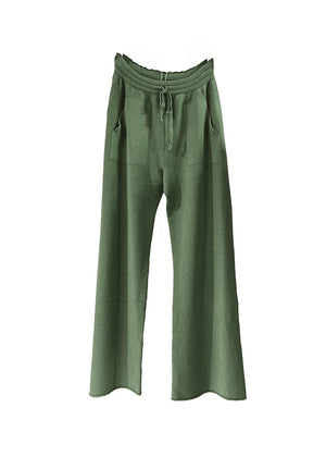 Dark olive green knit long wide pants with pockets on a white background