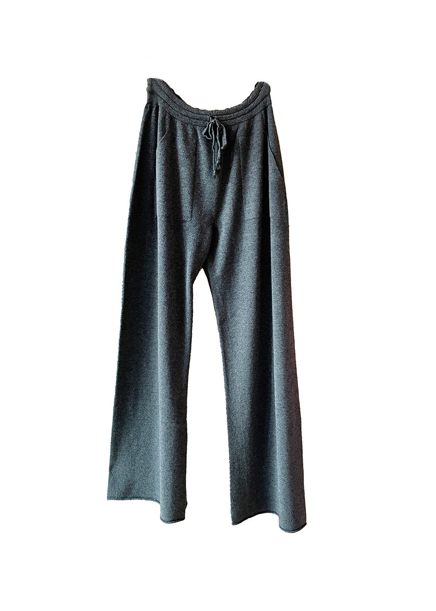 Dim grey knit long wide pants with pockets on a white background 