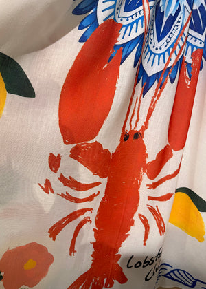 Close-up of a fabric with a lobster design on a white background