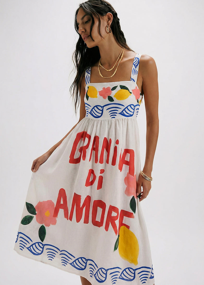 Woman wearing a dress with colorful fruit patterns and text on a white background