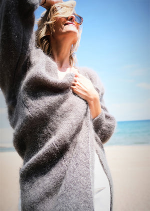 Person wearing a dim grey mohair long cardigan 
