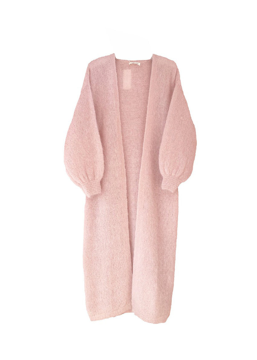 A pink mohair cardigan with long sleeves and a V-neck design, designed to be worn over other clothing items.