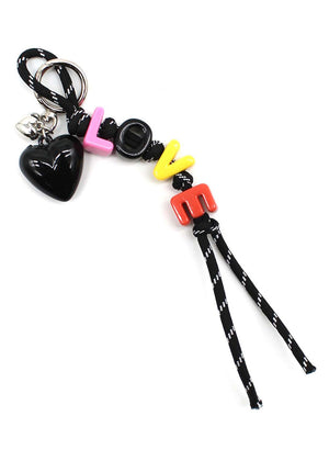 Keychain with colorful charms and black lanyard on a white background