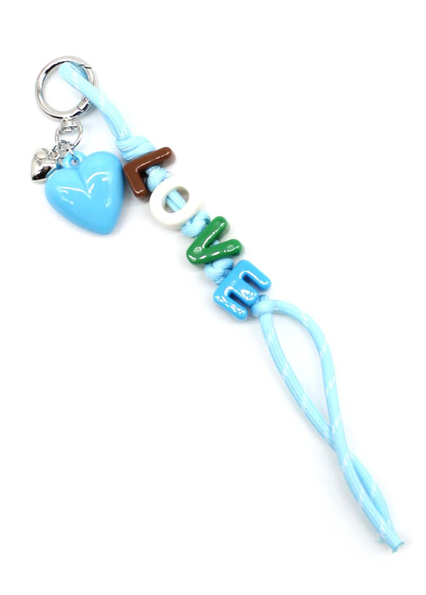 Keychain with heart, wooden stick, and 'LOVE' beads on a white background