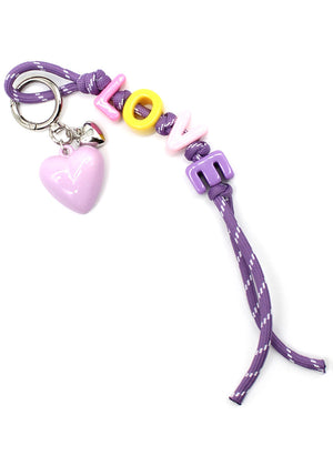 Purple keychain with heart charm and colorful beads on a white background