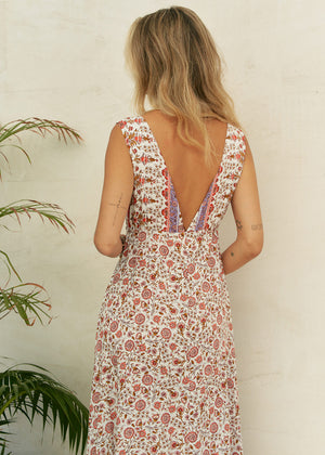 This dress features a timeless classic design, complete with a waist-defining cut and a deep V-neck on both the front and back. Crafted from 100% Rayon, it exudes a sense of effortless style and allure.