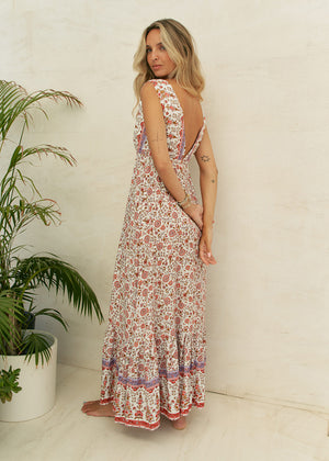 This dress features a timeless classic design, complete with a waist-defining cut and a deep V-neck on both the front and back. Crafted from 100% Rayon, it exudes a sense of effortless style and allure.