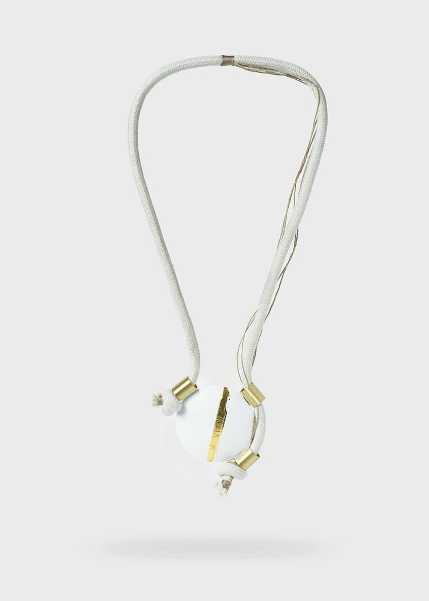 Necklace with gold and silver accents on a white background