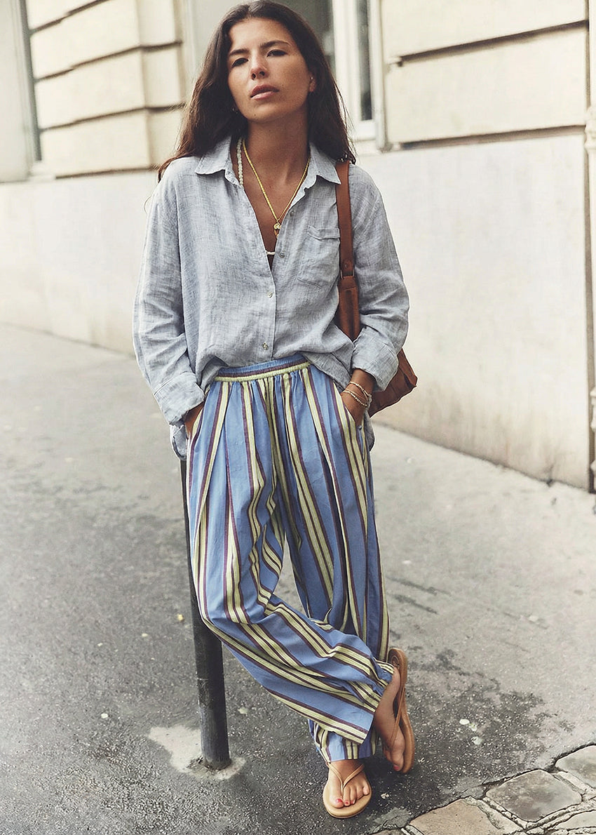 Light blue button-up shirt on a white background