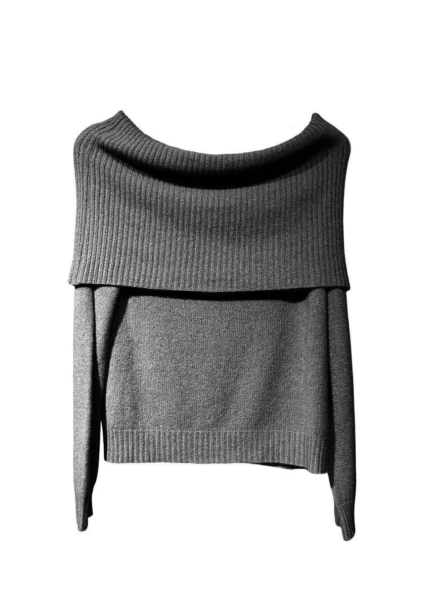 This black sweater embodies the beauty of simplicity. It features a light texture, straight cut, waffle neckline, and long sleeves - perfect for your everyday wardrobe.