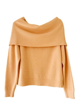 This sandy brown sweater embodies the beauty of simplicity. It features a light texture, straight cut, waffle neckline, and long sleeves - perfect for your everyday wardrobe.
