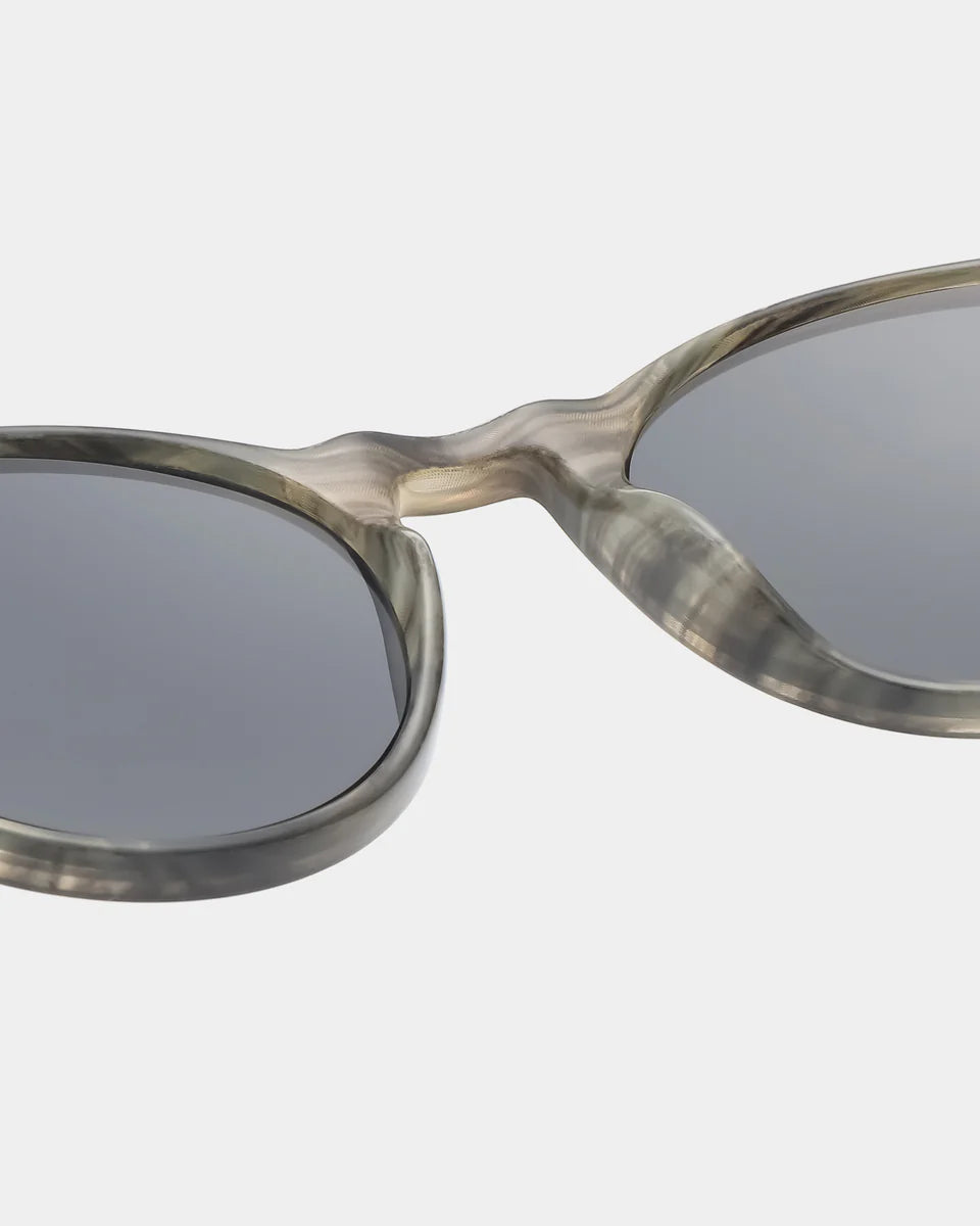 Sunglasses with a tortoiseshell frame on a white background