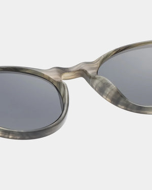 Sunglasses with a tortoiseshell frame on a white background