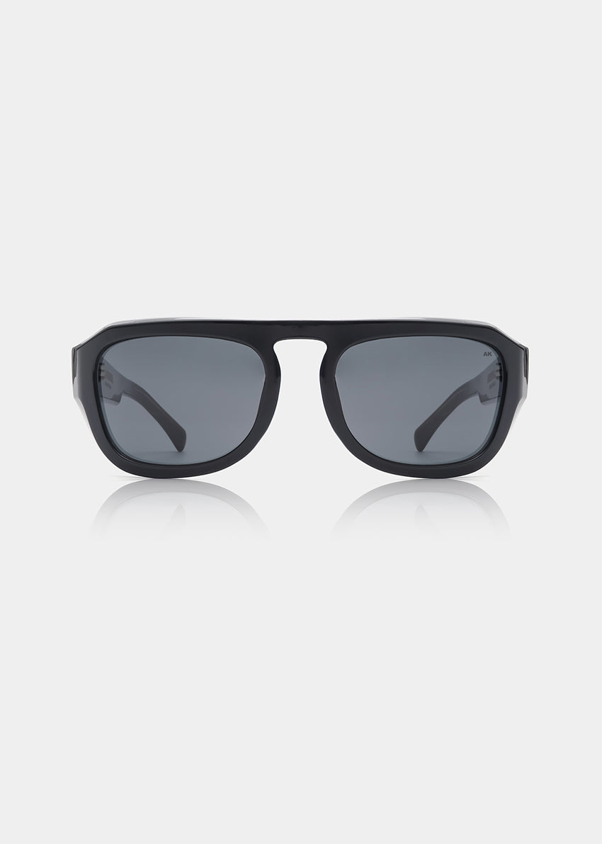 Black sunglasses with dark lenses on a white background