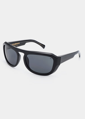 Black sunglasses with gold logo on a white background