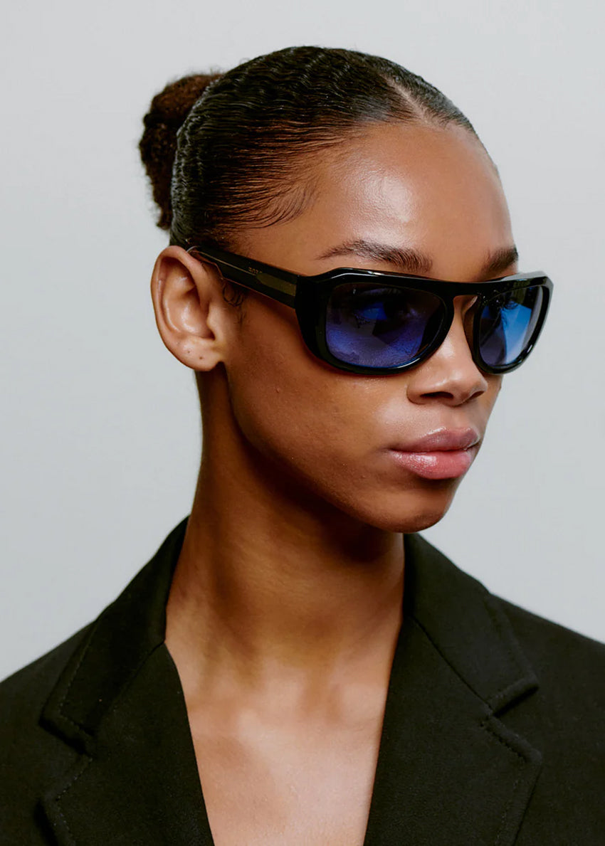Black sunglasses with blue lenses on a white background