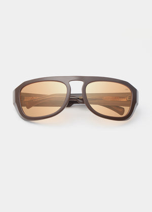 Wooden sunglasses with brown lenses on a white background