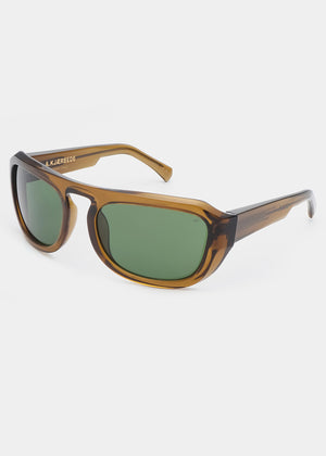 Sunglasses with tortoiseshell frame and green lenses on a white background