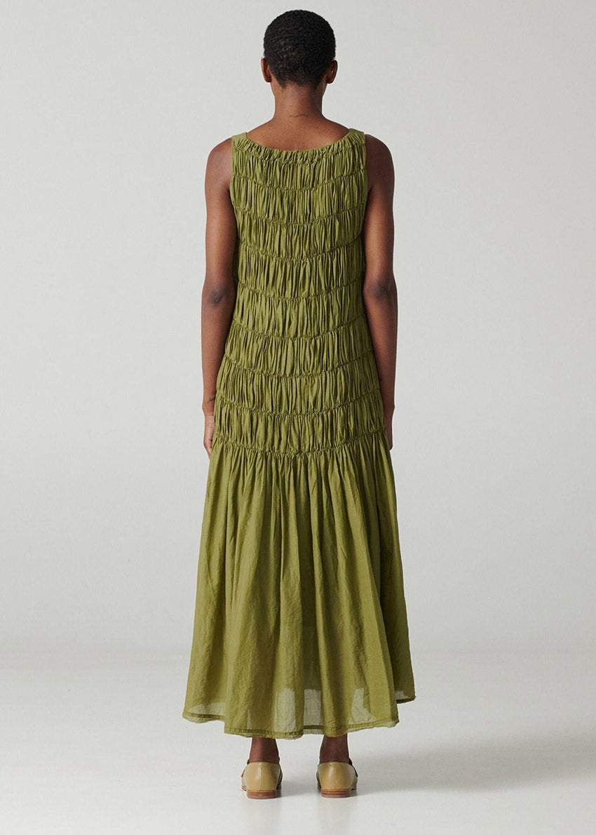 Long sleeveless dress with square neck and wide straps made of airy cotton voile fabric and shirred front.