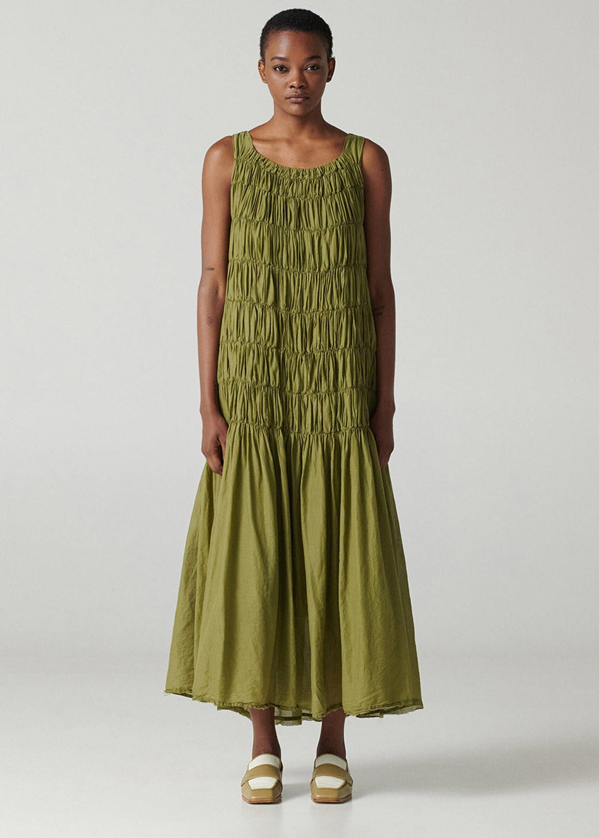 Long sleeveless dress with square neck and wide straps made of airy cotton voile fabric and shirred front.