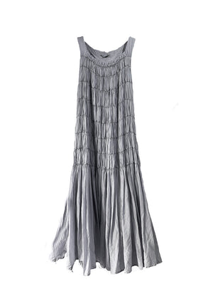 Long sleeveless dress with square neck and wide straps made of airy cotton voile fabric and shirred front.