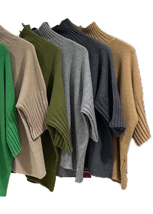 A very simple sweater with ribbed sleeves texture and turtle neck, the vertical ribs makes it classy and comfortable. Very easy to wear, medium length, this sweater is for intermediate spring/ autumn days.