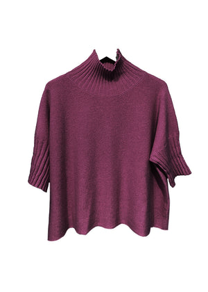 Dark red sweater on a hanger against a white background