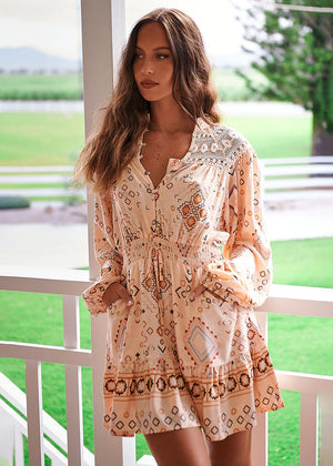 Featuring embroidered lace details, this little stunner has gorgeous long balloon sleeves with elastic cuffs. The top boasts a button-through front blouse silhouette with an elastic waist. The skirt is fun and flirty, with a fit-and-flare mini silhouette.