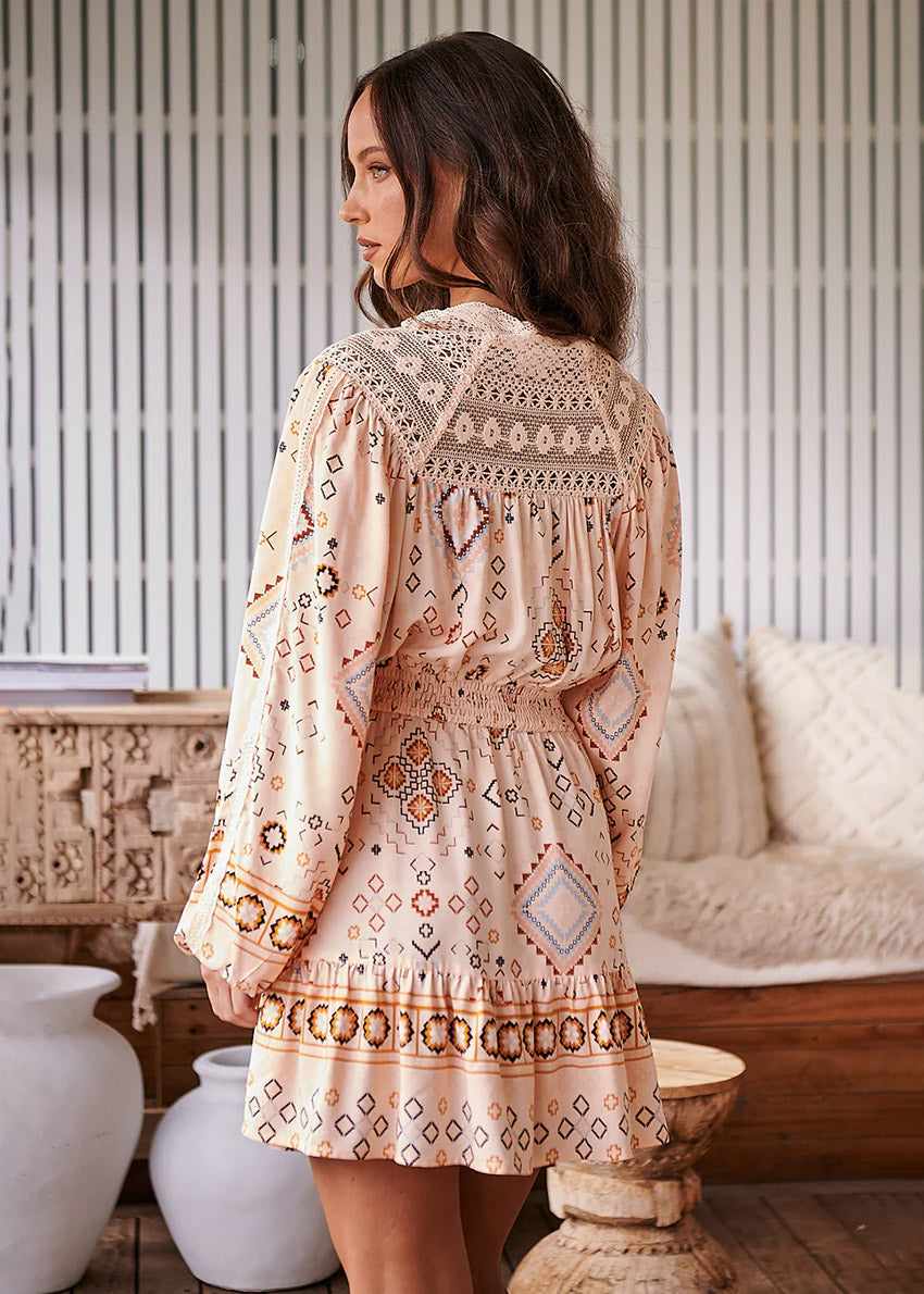 Featuring embroidered lace details, this little stunner has gorgeous long balloon sleeves with elastic cuffs. The top boasts a button-through front blouse silhouette with an elastic waist. The skirt is fun and flirty, with a fit-and-flare mini silhouette.