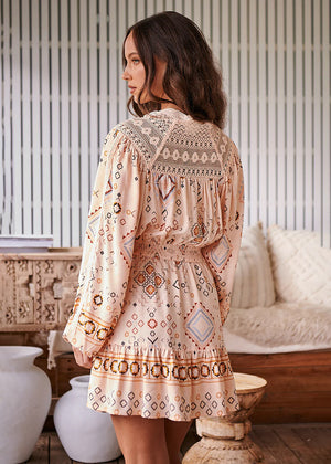 Featuring embroidered lace details, this little stunner has gorgeous long balloon sleeves with elastic cuffs. The top boasts a button-through front blouse silhouette with an elastic waist. The skirt is fun and flirty, with a fit-and-flare mini silhouette.