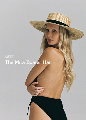 Woman wearing a straw boater hat with text 'Meet The Mira Boater Hat' on a plain background