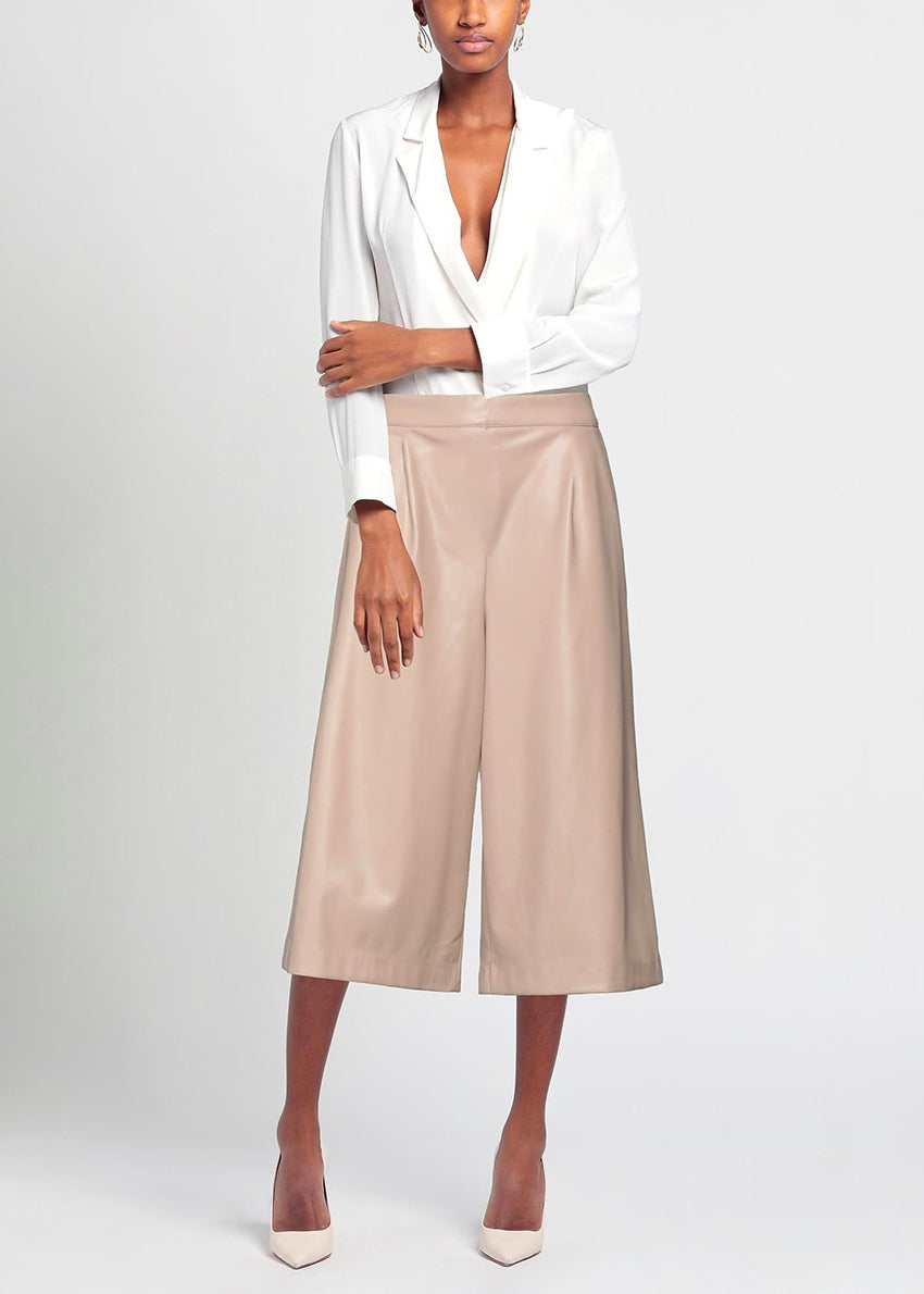 Beige wide-leg pants on a white background