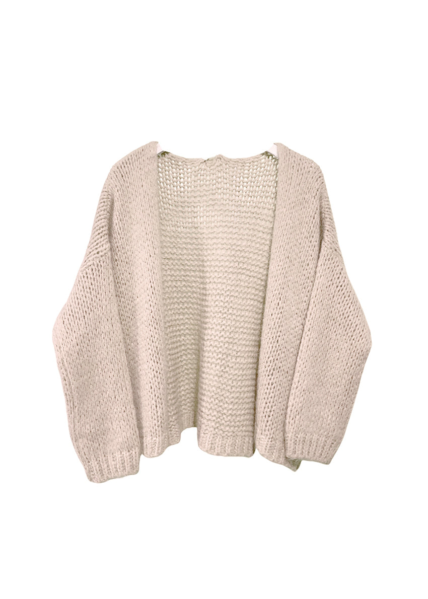 Beige knitted cardigan on a white background