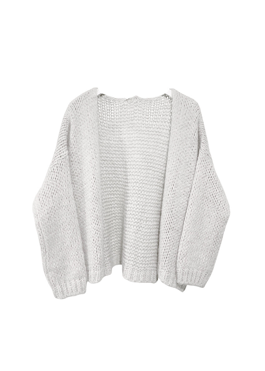 White knit cardigan on a white background