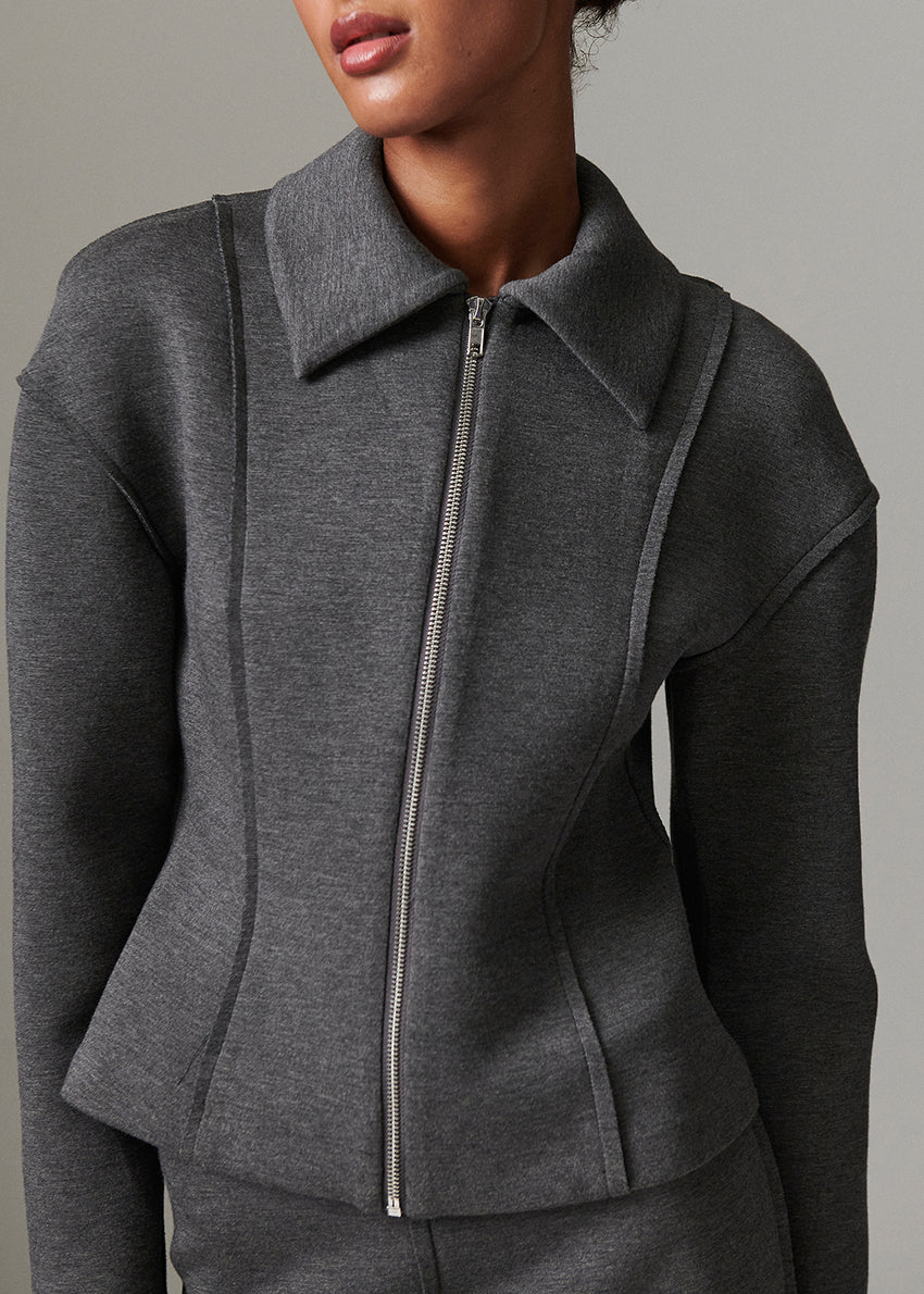 Gray jacket with a zipper on a neutral background
