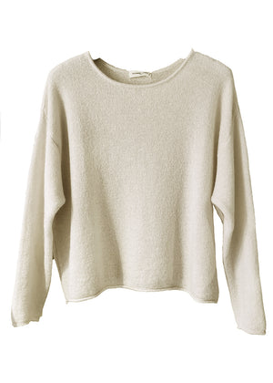 Cornsilk sweater on a white background