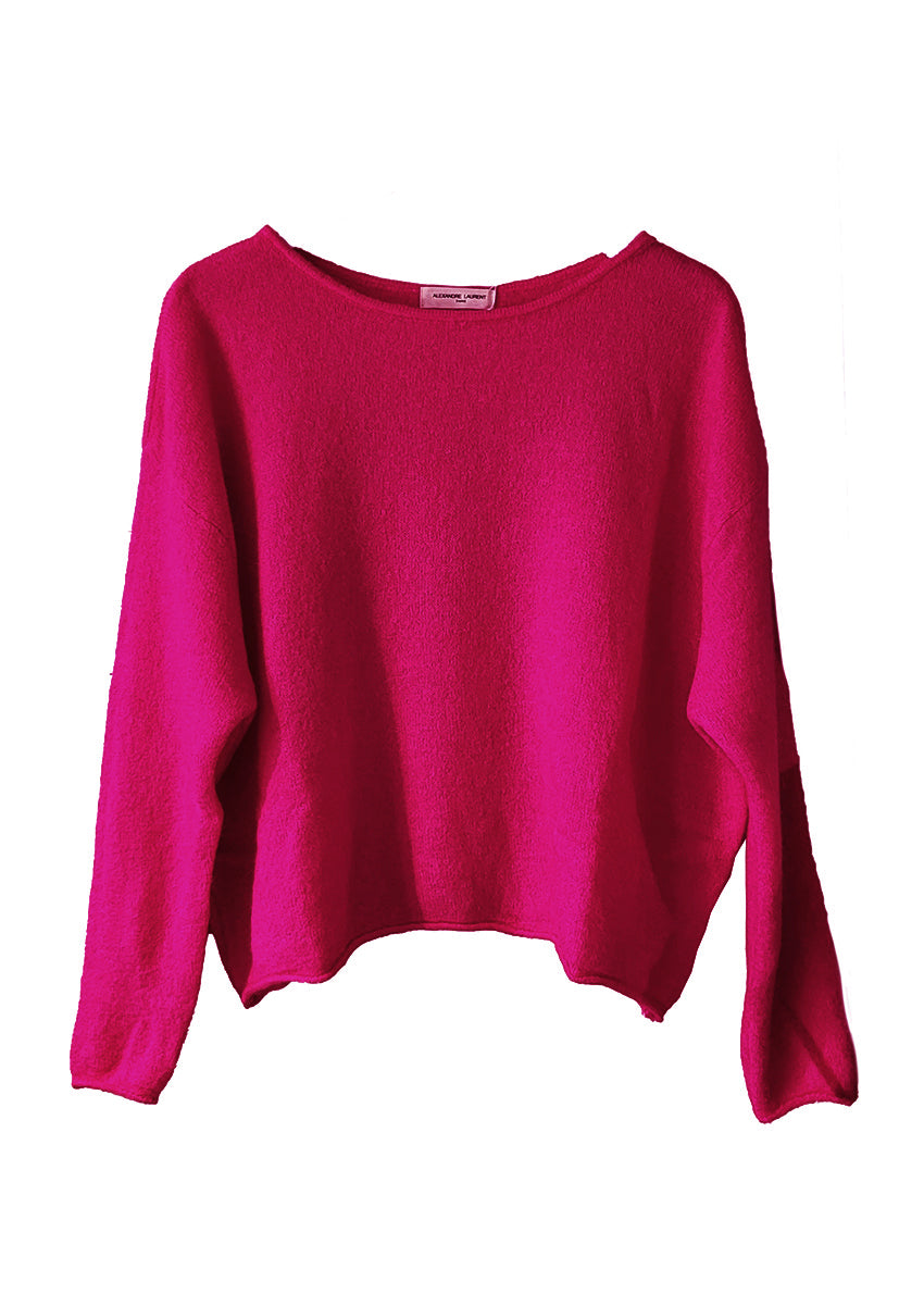 Pink sweater on a white background