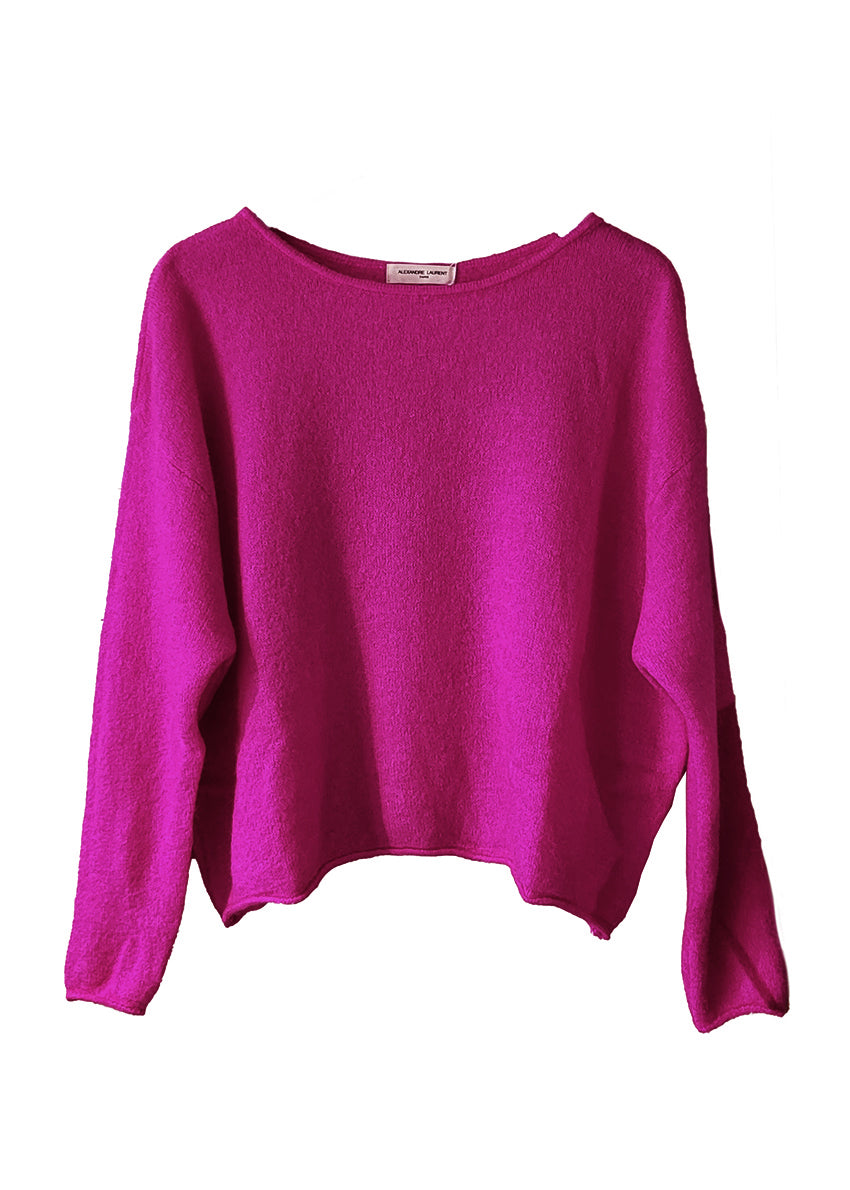 Pink sweater on a white background